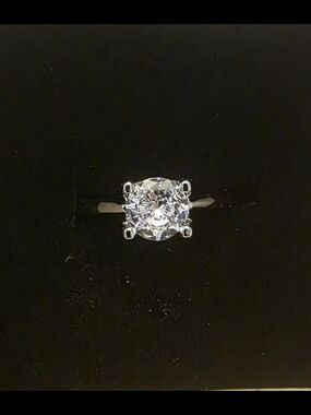 Round-Cut White Stone Solitaire Ring in Sterling Silver